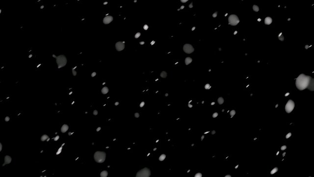 It is snowing foreground layer, Real snow isolated on black background Winter