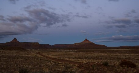 Sunrise Time Lapse of Red Rock Desert Tower with Clouds on Utah Public Lands