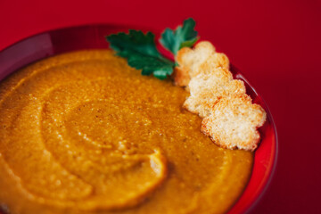 Delicious lentil cream-soup on table.  Homemade soup.