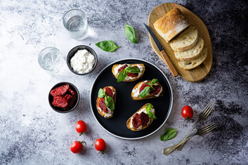 Ricotta dried tomato Basil bruschetta