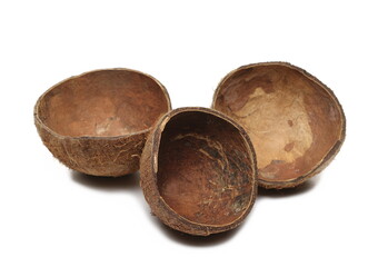 Coconut fruit shells cut in half isolated on white background side view