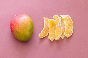 Fresh mango and dry fruit isolated on brown background
