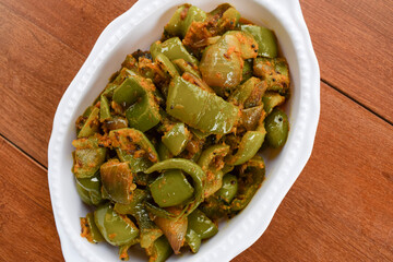 Indian capsicum masala sabji. Bellpepper cubed sliced spiced. Shimla mirch with Onion curry