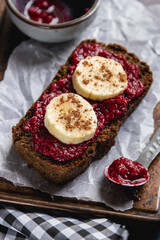 slice of Chocolate bread with banana topping and blackberry jam