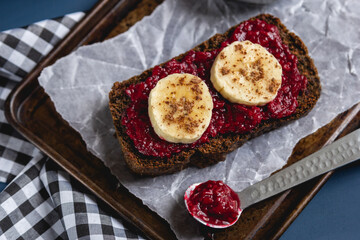 Gluten free chocolate and flaxweed bread with banana and blackberry jam