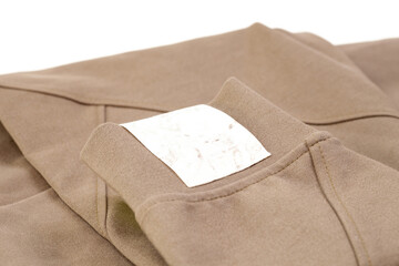 macro mock up empty white marble fabric patch for brand logo, tag for name or clothing care instructions.