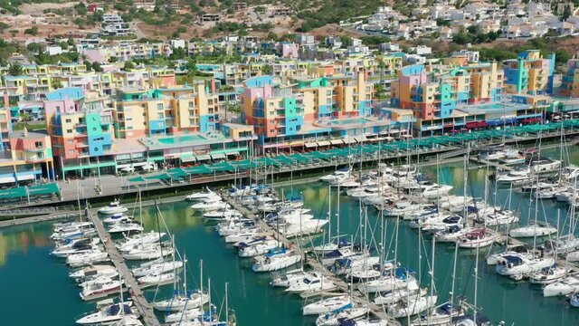 Albufeira, Portugal. Aerial vista of colorful low-rise buildings by the ocean. Coastal town with traditional architecture as seen from above. High quality 4k footage