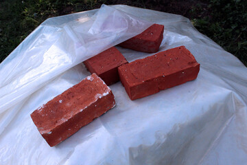 bricks holding the cover