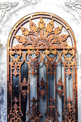 Fototapeta na wymiar Wrought iron door in cemetery