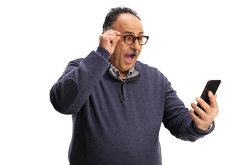 Excited mature man looking at his smartphone