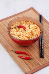 Chinese noodles with vegetables, soy sauce on a white plate
