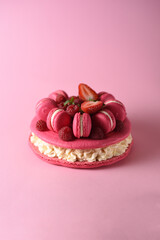 macarons - legend of French cuisine on a pink background. an exquisite dessert with a refined taste.
