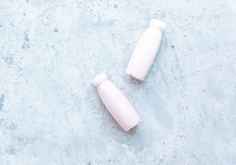 Flat lay Tasty strawberry milk shake in bottle on white background. Strawberry smoothies. Strawberry and yogurt. Top view, flat lay, copy space