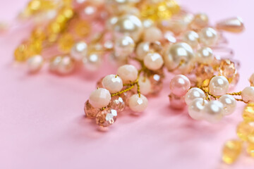 Beautiful hair decoration handmade comb in beads, close-up, pink background