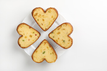 Cupcakes with marmalade in shape of heart on white plate