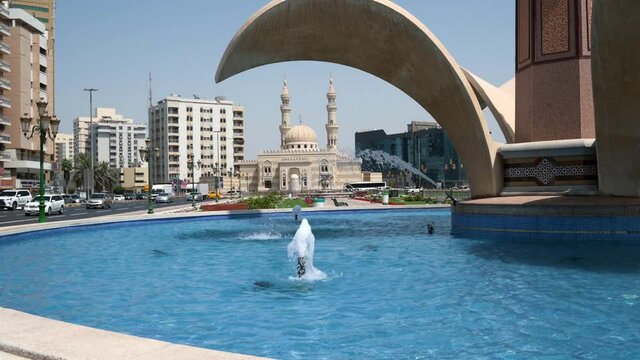 Zahra mosque and Clock Tower fountain in Sharjah emirate downtown in the UAE