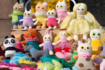 handmade dolls on display for sale in open air
