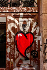 gtaffiti heart on old wooden door in Barcelona