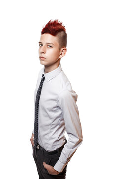 Portrait of serious teen with red mohawk wearing shirt and tie while looking at camera. Isolated.