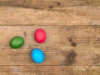 Easter eggs on a wooden background. The symbol of Easter.