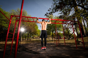 Man doing resistance exercises in the park