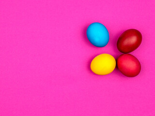 Bright painted eggs for Easter. Pink background.