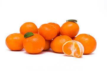 ripe whole tangerines and half fruit on a white background isolated