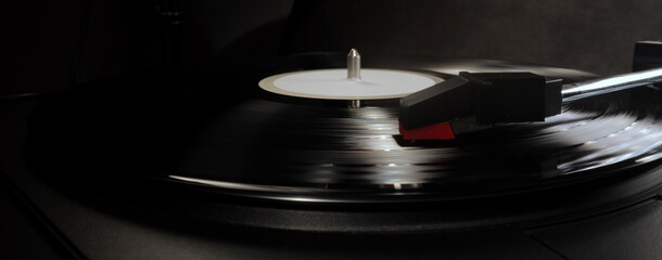 Record player in close-up - playing a vinyl - studio photography