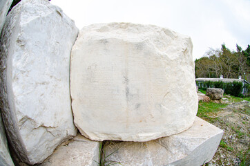 Parallel to the great retaining wall a series of monumental bases held votives to Amphiaraus