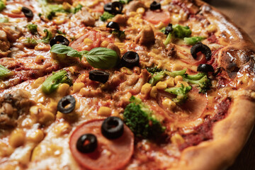 Close-up of an italian pizza with ingredients. Selective focus