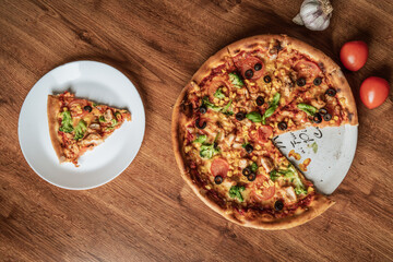 Close-up of an italian pizza with ingredients. Selective focus