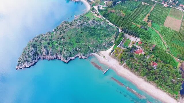 Aspect of Ancient Asine, Greece, and its beautiful turquoise sea on a calm day