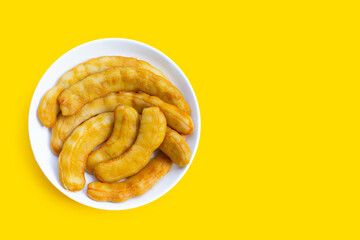 Tamarind pickled fermented on yellow background.