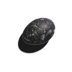 Black painted egg for Easter on a white background