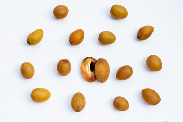Fresh half sapodilla fruit and whole isolated on white background.