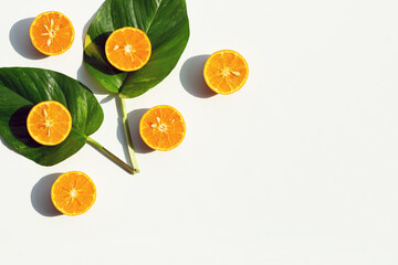 High vitamin C, Juicy and sweet. Fresh orange fruit with green leaves