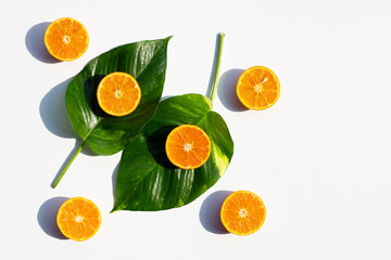 High vitamin C, Juicy and sweet. Fresh orange fruit with green leaves