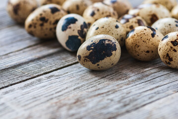Fototapeta premium Quail eggs on old wooden table