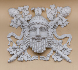 Frescoes, stucco on the facade of the building, city street