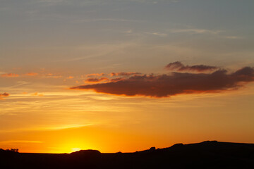sunset with montain chain silhouette