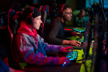 Professional esports players at an online game tournament. The cyber team plays computers and trains
