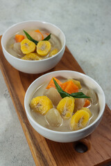 Kolak pisang ubi is an Indonesian dessert based on banana, sweet potato, palm sugar or coconut sugar, coconut milk, and pandanus leaf