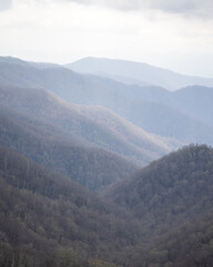Fototapeta premium sunset on mountains in the spring fog