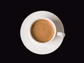 Coffee with milk in a white cup on a black glass background. Studio photography