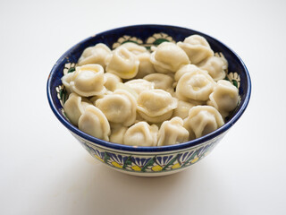 Dumplings in the national dish. Russian and Asian traditional cuisine. Studio photography