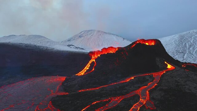 Aerial footage of the eruption in Fagradalsfjall in southern Iceland in 2021, shot in winter with snow on the ground