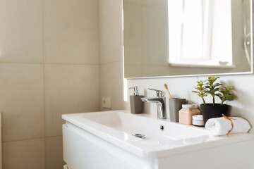 Fototapeta premium Washbasin in bathroom, bath accessories. Household, hotel cleaning concept