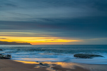 Fototapeta na wymiar High Cloud Sunrise Seascape with Soft Shades of Colour