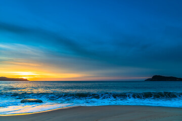 Fototapeta na wymiar High Cloud Sunrise Seascape with Soft Shades of Colour