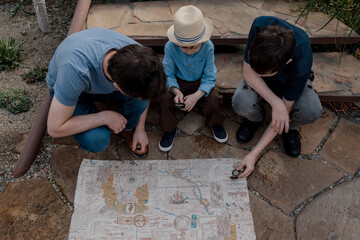 Adventurous family inspecting tropical gallery in Botanical garden. Local travel